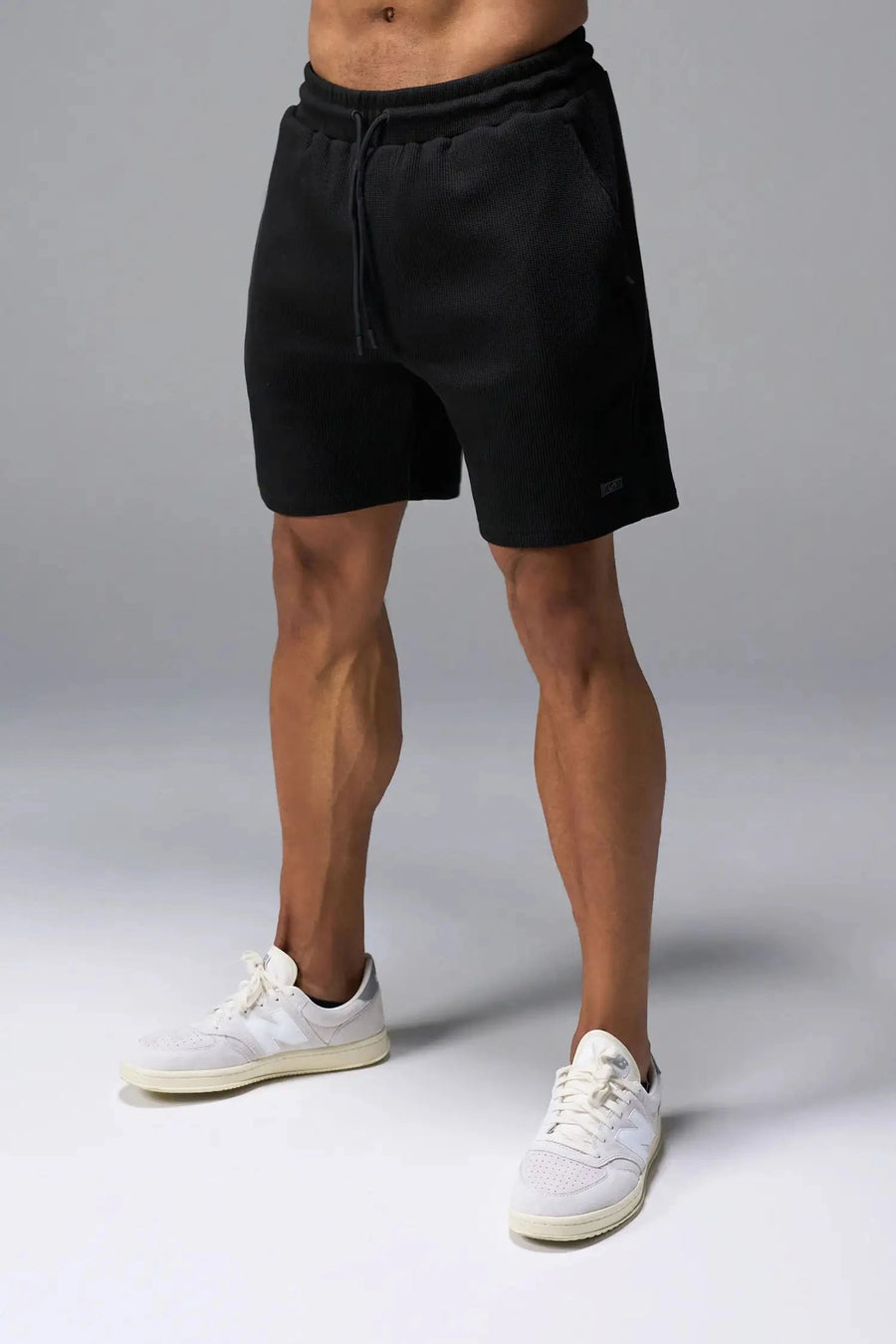 Front View of Black TLF GTS Waffle Tech Shorts, featuring a 6” Inch inseam, an athletic relaxed fit with zipper pockets designed for all day wear