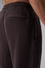 Back View of Brown the TLF GTS Waffle Tech Straight Leg Pants featuring pintuck detailing, zippered pockets and straight leg design