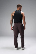 Back View of Brown the TLF GTS Waffle Tech Straight Leg Pants featuring pintuck detailing, zippered pockets and straight leg design