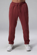 Front View of Red the TLF GTS Waffle Tech Straight Leg Pants featuring pintuck detailing, zippered pockets and straight leg design