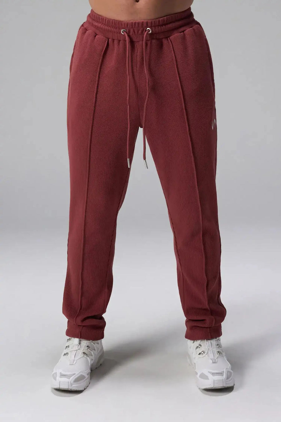 Front View of Red the TLF GTS Waffle Tech Straight Leg Pants featuring pintuck detailing, zippered pockets and straight leg design