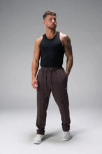 Front View of Brown the TLF GTS Waffle Tech Straight Leg Pants featuring pintuck detailing, zippered pockets and straight leg design