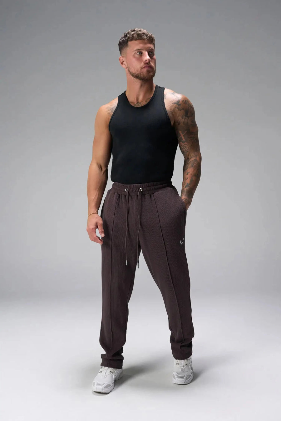 Front View of Brown the TLF GTS Waffle Tech Straight Leg Pants featuring pintuck detailing, zippered pockets and straight leg design