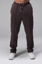 Front View of Brown the TLF GTS Waffle Tech Straight Leg Pants featuring pintuck detailing, zippered pockets and straight leg design