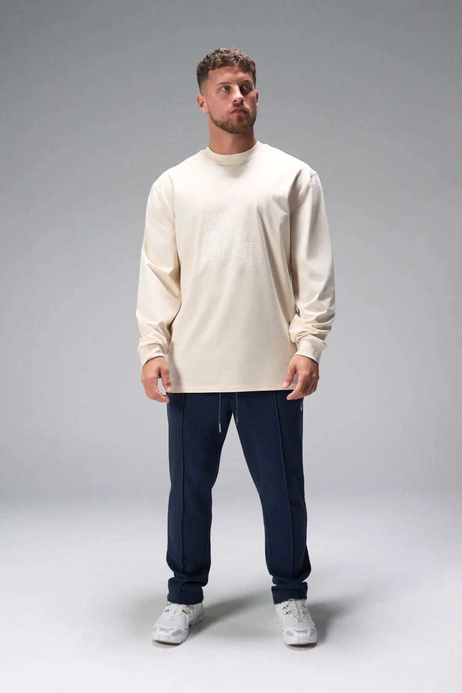Front View of Blue the TLF GTS Waffle Tech Straight Leg Pants featuring pintuck detailing, zippered pockets and straight leg design