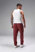 Back View of Red the TLF GTS Waffle Tech Straight Leg Pants featuring pintuck detailing, zippered pockets and straight leg design