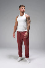 Front View of Red the TLF GTS Waffle Tech Straight Leg Pants featuring pintuck detailing, zippered pockets and straight leg design