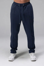 Front View of Blue the TLF GTS Waffle Tech Straight Leg Pants featuring pintuck detailing, zippered pockets and straight leg design