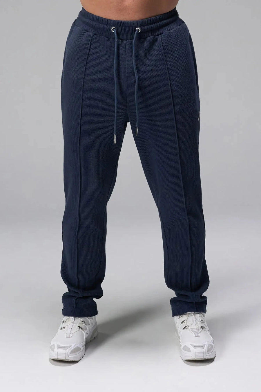 Front View of Blue the TLF GTS Waffle Tech Straight Leg Pants featuring pintuck detailing, zippered pockets and straight leg design