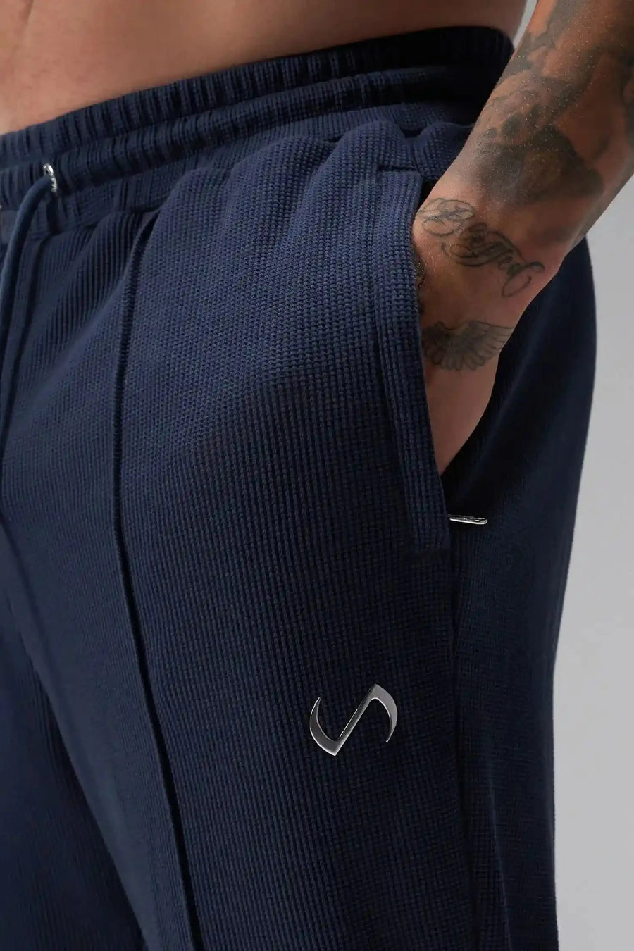Front View of Blue the TLF GTS Waffle Tech Straight Leg Pants featuring pintuck detailing, zippered pockets and straight leg design