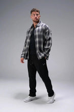 Front View of Black the TLF GTS Waffle Tech Straight Leg Pants featuring pintuck detailing, zippered pockets and straight leg design