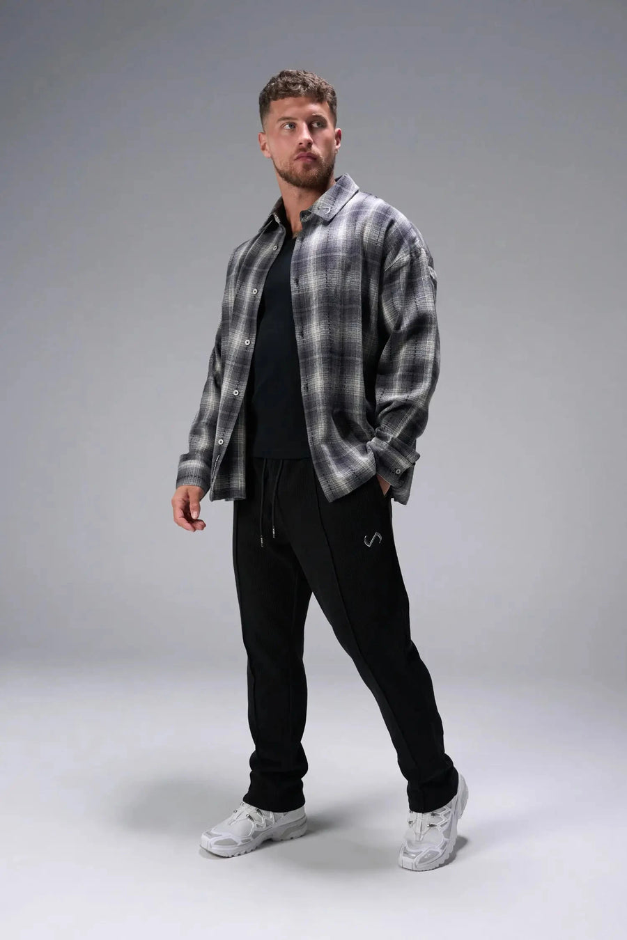 Front View of Black the TLF GTS Waffle Tech Straight Leg Pants featuring pintuck detailing, zippered pockets and straight leg design