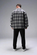 Back View of Black the TLF GTS Waffle Tech Straight Leg Pants featuring pintuck detailing, zippered pockets and straight leg design