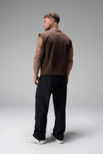 Back View of Brown the TLF Icon Muscle Tank featuring our physique enhancing design, straight hem and relaxed fit. 