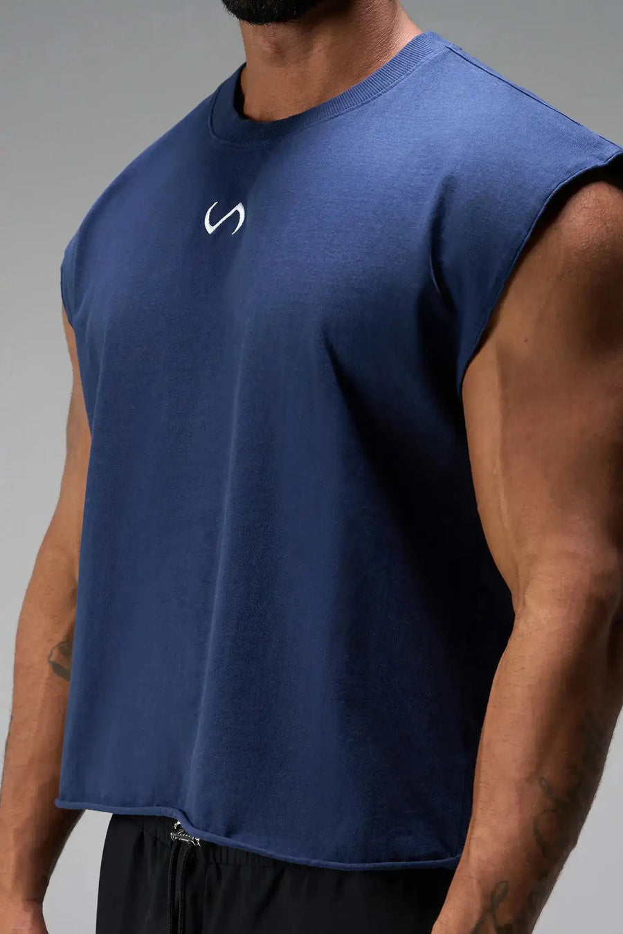 Front View of Blue the TLF Icon Muscle Tank featuring our physique enhancing design, straight hem and relaxed fit. 