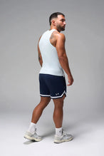 Side View of Light Blue Icon Ribbed Straight Hem Tank featuring our physique enhancing design, straight hem and relaxed fit