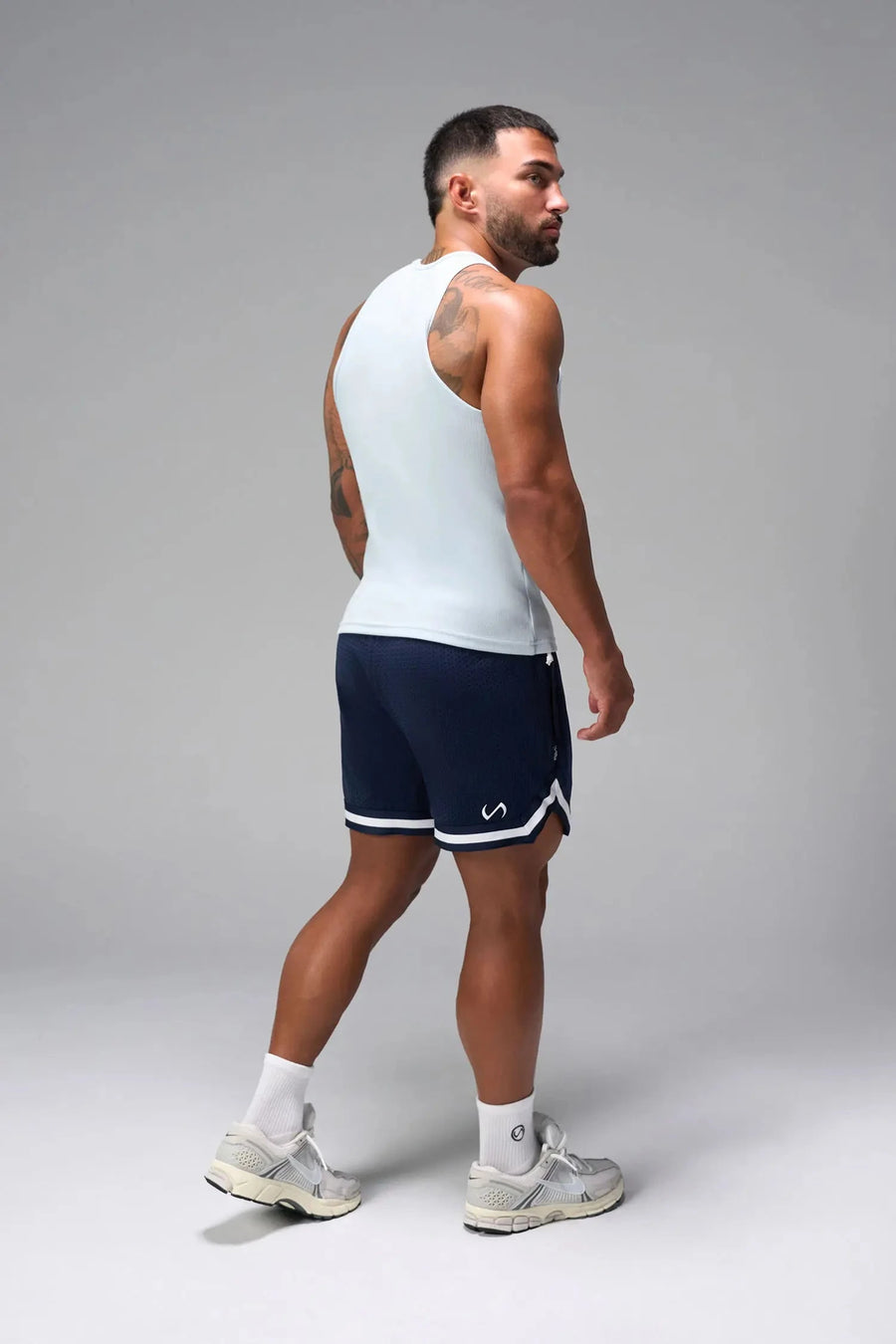 Side View of Light Blue Icon Ribbed Straight Hem Tank featuring our physique enhancing design, straight hem and relaxed fit