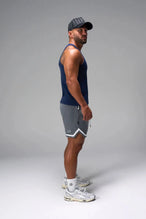 Side View of Blue Icon Ribbed Straight Hem Tank featuring our physique enhancing design, straight hem and relaxed fit