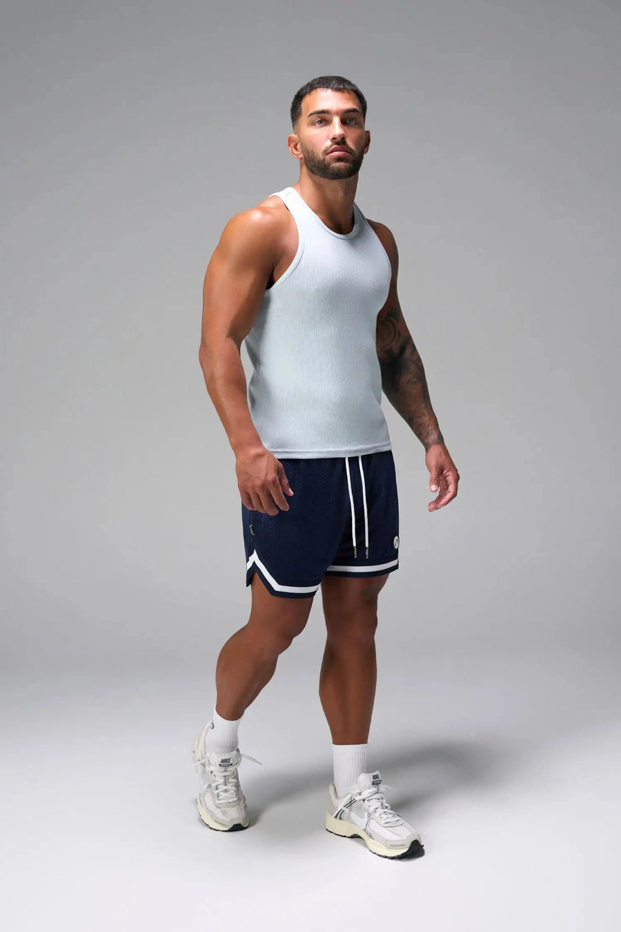 Front View of Light Blue Icon Ribbed Straight Hem Tank featuring our physique enhancing design, straight hem and relaxed fit