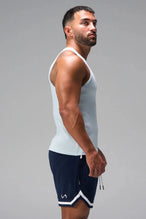 Side View of Light Blue Icon Ribbed Straight Hem Tank featuring our physique enhancing design, straight hem and relaxed fit