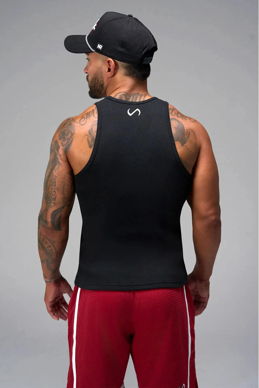 Back View of Black Icon Ribbed Straight Hem Tank featuring our physique enhancing design, straight hem and relaxed fit