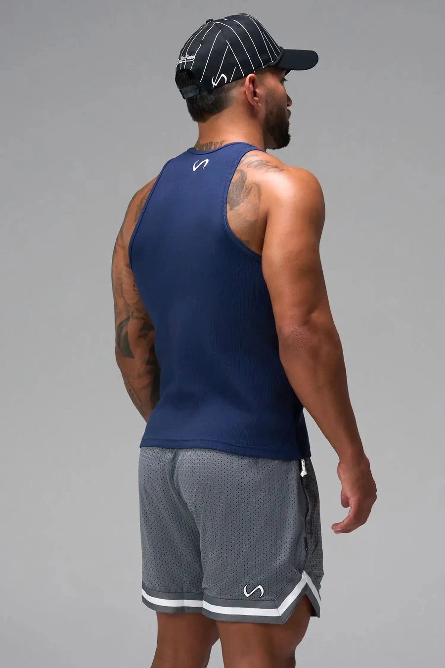 Back View of Blue Icon Ribbed Straight Hem Tank featuring our physique enhancing design, straight hem and relaxed fit