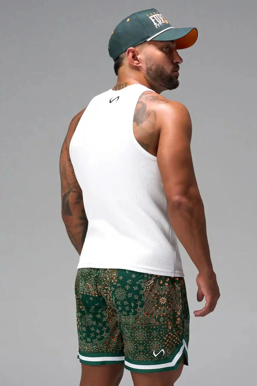 Side View of White Icon Ribbed Straight Hem Tank featuring our physique enhancing design, straight hem and relaxed fit