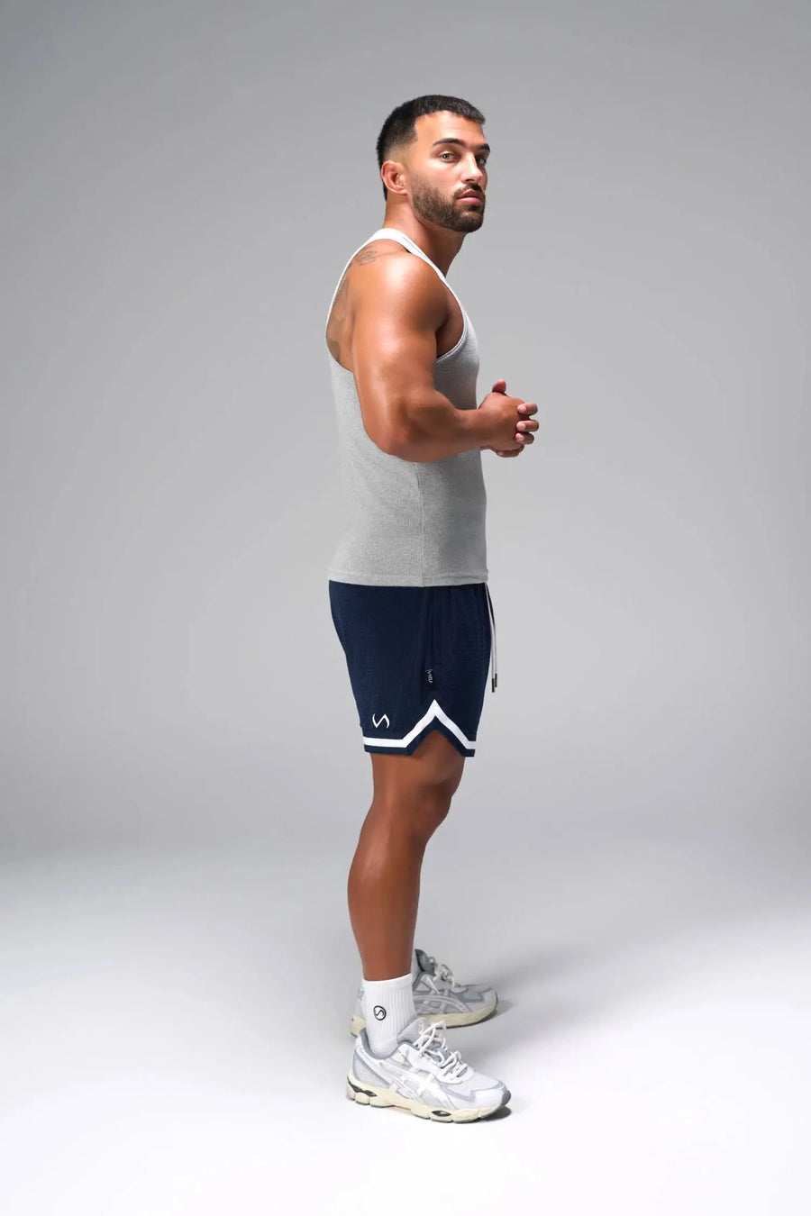 Side View of Gray Icon Ribbed Straight Hem Tank featuring our physique enhancing design, straight hem and relaxed fit