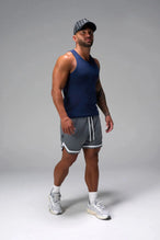 Side View of Blue Icon Ribbed Straight Hem Tank featuring our physique enhancing design, straight hem and relaxed fit