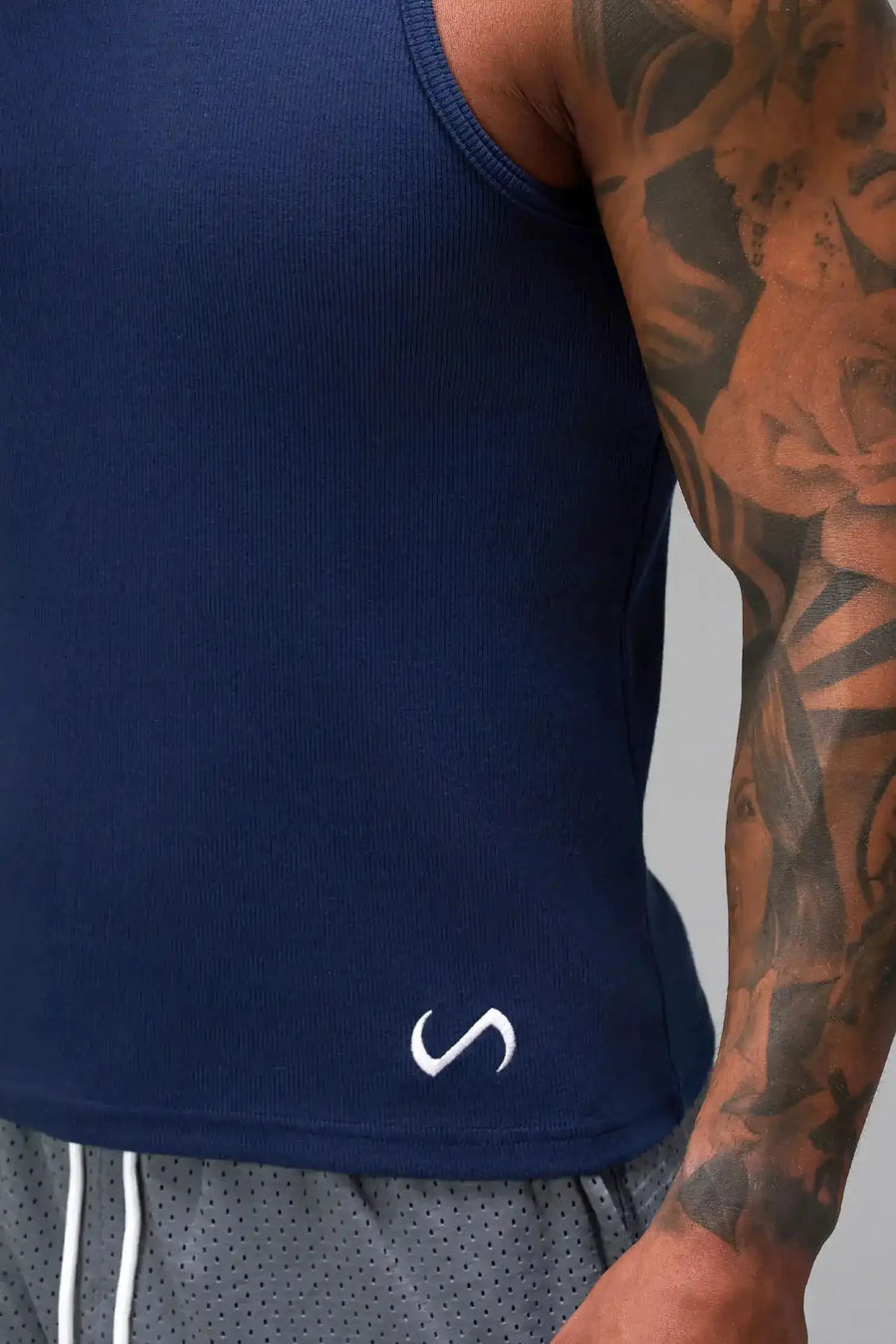 Front View of Blue Icon Ribbed Straight Hem Tank featuring our physique enhancing design, straight hem and relaxed fit
