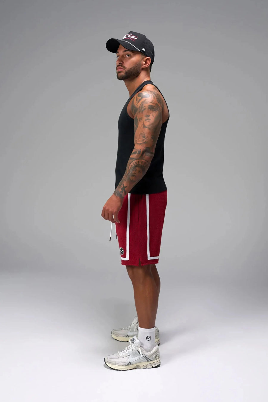 Side View of Black Icon Ribbed Straight Hem Tank featuring our physique enhancing design, straight hem and relaxed fit