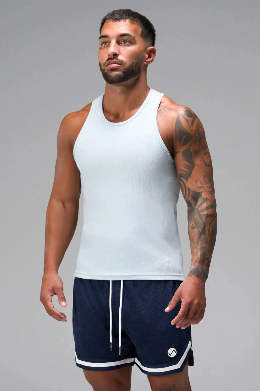 Front View of Light Blue Icon Ribbed Straight Hem Tank featuring our physique enhancing design, straight hem and relaxed fit