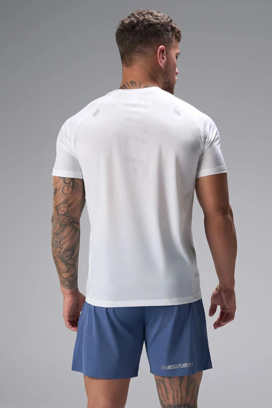Back View of White the TLF Infi Cool Lightweight Cooling Shirt engineered with cooling fabric technology, raglan sleeves and laser cut perforations