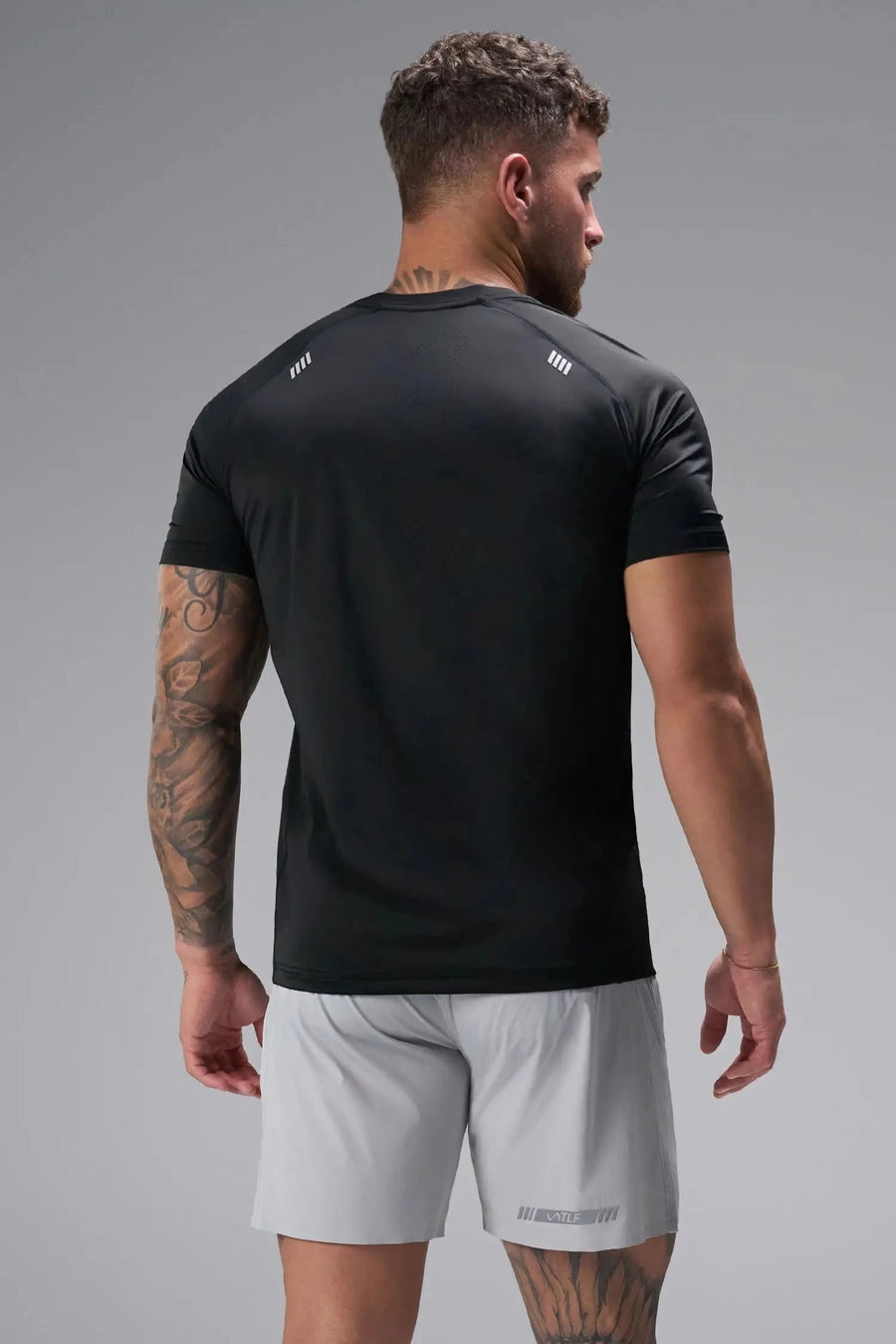 Back View of Black the TLF Infi Cool Lightweight Cooling Shirt engineered with cooling fabric technology, raglan sleeves and laser cut perforations. 