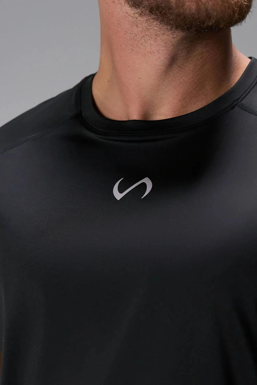 Front View of Black the TLF Infi Cool Lightweight Cooling Shirt engineered with cooling fabric technology, raglan sleeves and laser cut perforations. 