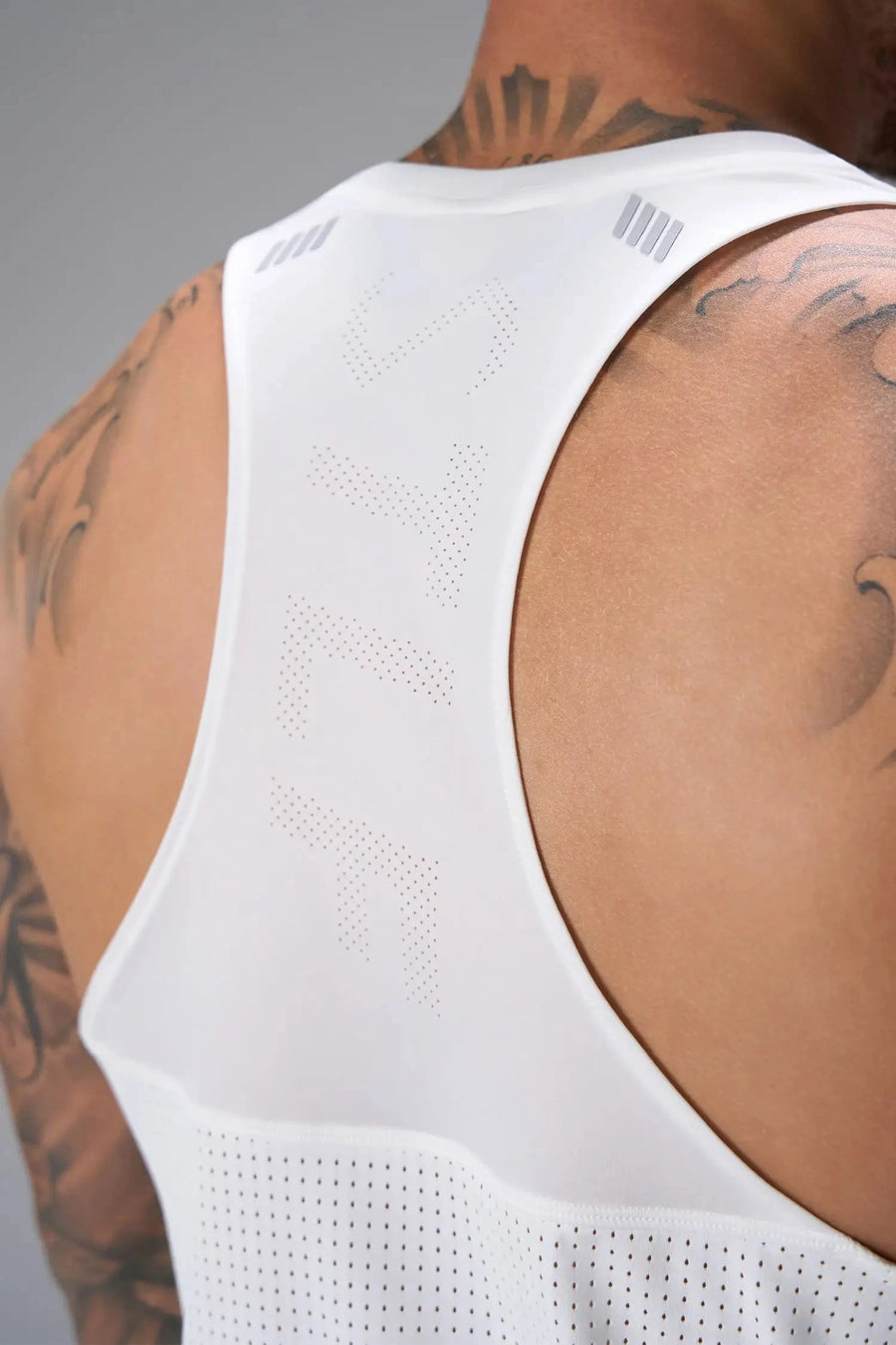 Back View of White the TLF Infi Cool workout tank engineered with infi cool DNA cooling fabric technology, laser cut mesh holes and perforations