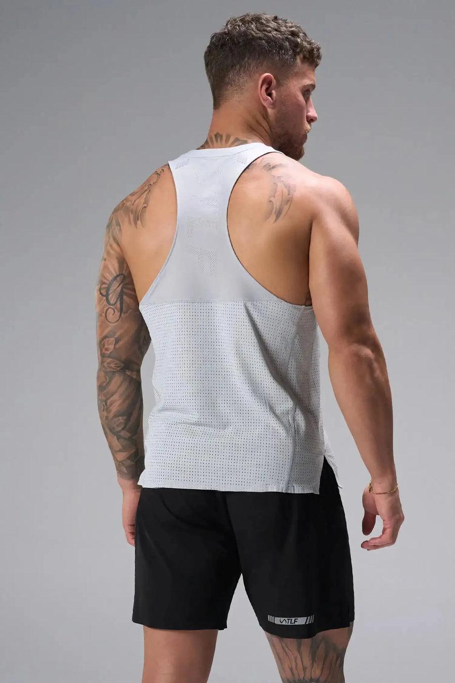 Back View of Gray the TLF Infi Cool workout tank engineered with infi cool DNA cooling fabric technology, laser cut mesh holes and perforations