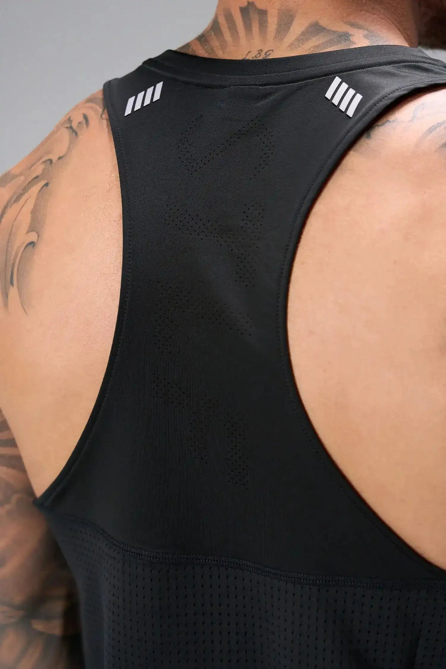 Back View of Black the TLF Infi Cool workout tank engineered with infi cool DNA cooling fabric technology, laser cut mesh holes and perforations