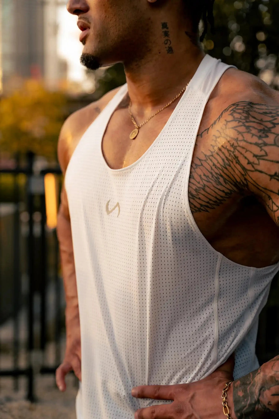 Front View of White the TLF Infi Cool workout tank engineered with infi cool DNA cooling fabric technology, laser cut mesh holes and perforations