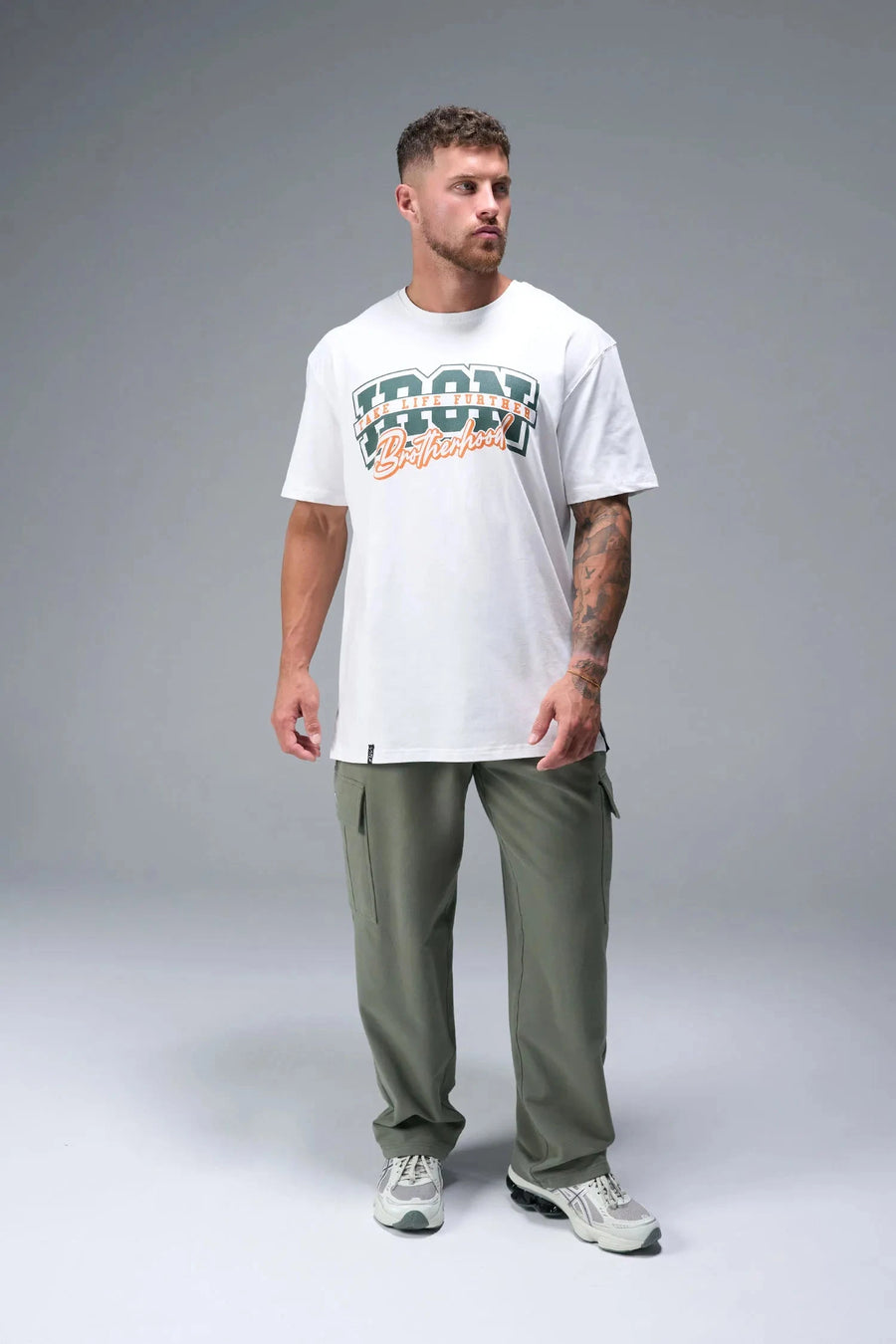 Front view of White TLF Iron Bros Cotton Luxe Oversized Tee featuring “cooling shirt” technology with a 2-tone graphic print across the chest.  