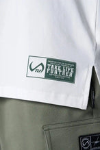 Front view of White TLF Iron Bros Cotton Luxe Oversized Tee featuring “cooling shirt” technology with a 2-tone graphic print across the chest.  