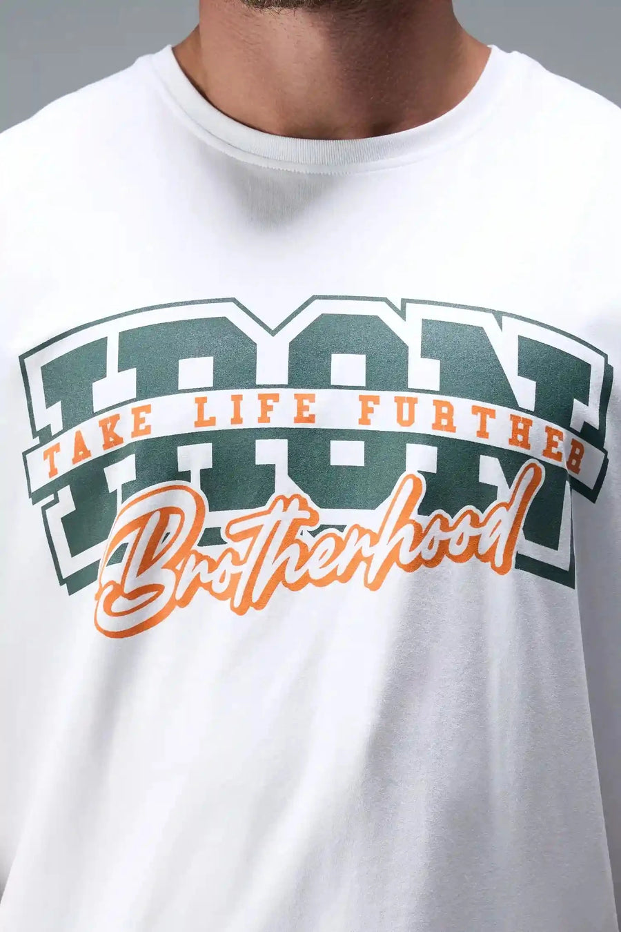 Front view of White TLF Iron Bros Cotton Luxe Oversized Tee featuring “cooling shirt” technology with a 2-tone graphic print across the chest.  