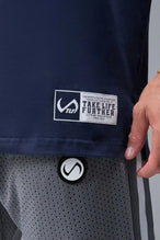 Front View of Blue TLF Iron Bros Cotton Luxe Oversized Tee featuring “cooling shirt” technology with a 2-tone graphic print across the chest.  