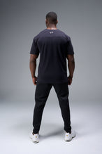 Close Up View of Black TLF Lifting Crew Cotton Luxe Oversized Tee featuring a 2-tone graphic print design across the chest.  