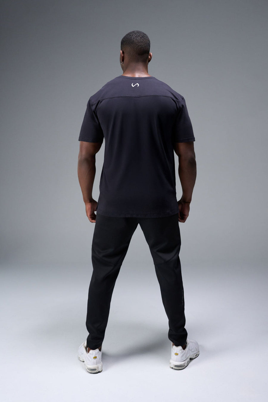 Close Up View of Black TLF Lifting Crew Cotton Luxe Oversized Tee featuring a 2-tone graphic print design across the chest.  