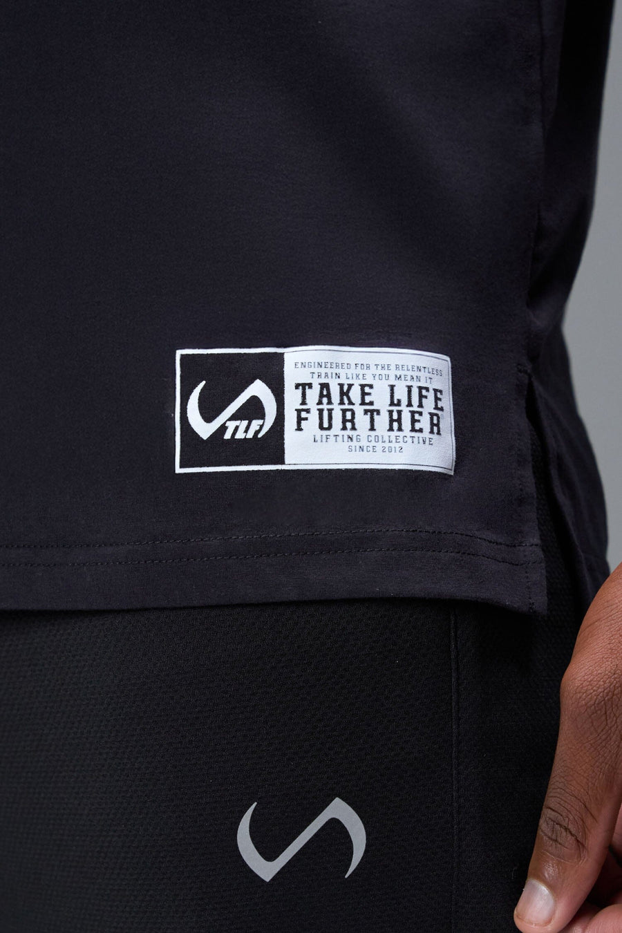 Front View of Black TLF Lifting Crew Cotton Luxe Oversized Tee featuring a 2-tone graphic print design across the chest.  