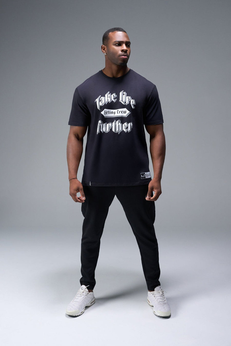 Front View of Black TLF Lifting Crew Cotton Luxe Oversized Tee featuring a 2-tone graphic print design across the chest.  