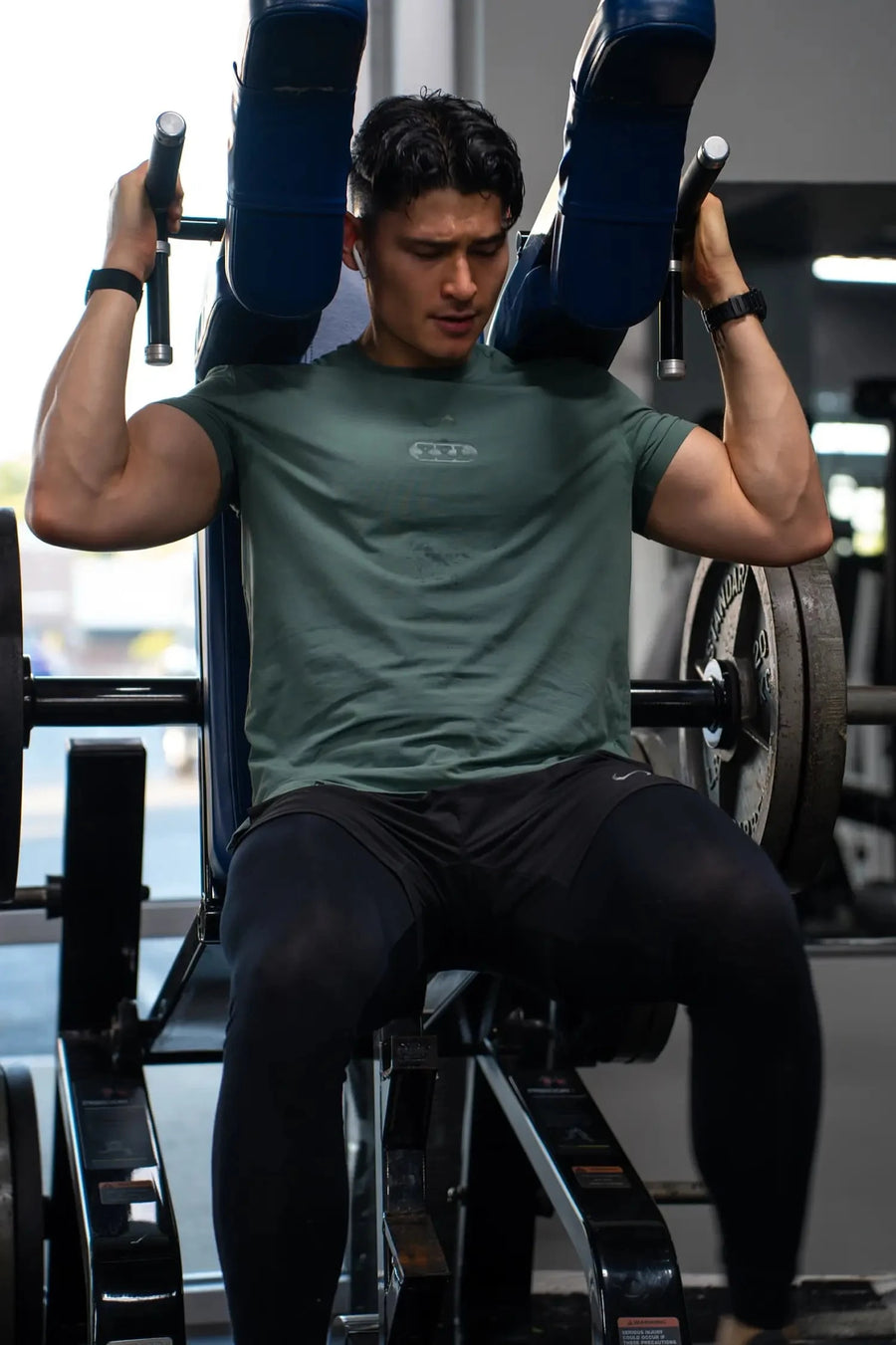 Front View of Green TLF Lifting Team Cotton Luxe Swole Tee, a gym shirt with a physique enhancing fit and a tonal graphic print 