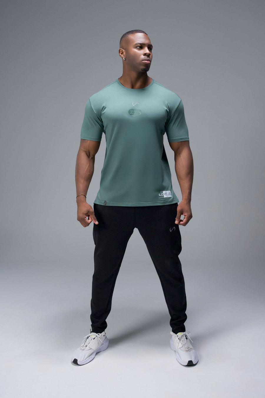 Front View of Green TLF Lifting Team Cotton Luxe Swole Tee, a gym shirt with a physique enhancing fit and a tonal graphic print 