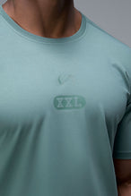 Front View of Green TLF Lifting Team Cotton Luxe Swole Tee, a gym shirt with a physique enhancing fit and a tonal graphic print 